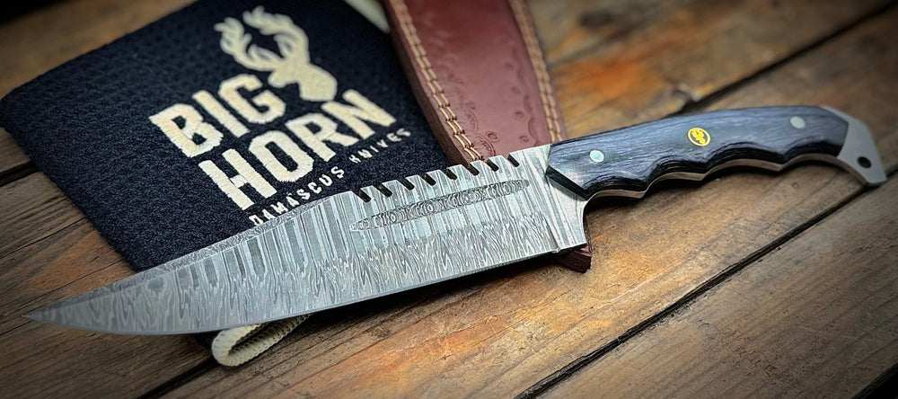 A BigHorn Steel Damascus steel Bowie knife with sheath and polishing cloth